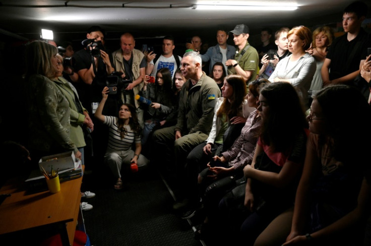 Kyiv Mayor Vitali Klitschko (c) with other residents of the Ukraine capital in a packed underground shelter this month