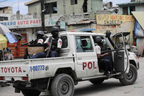 Police patrol the streets after gang members tried to attack a police station, in Port-au-Prince