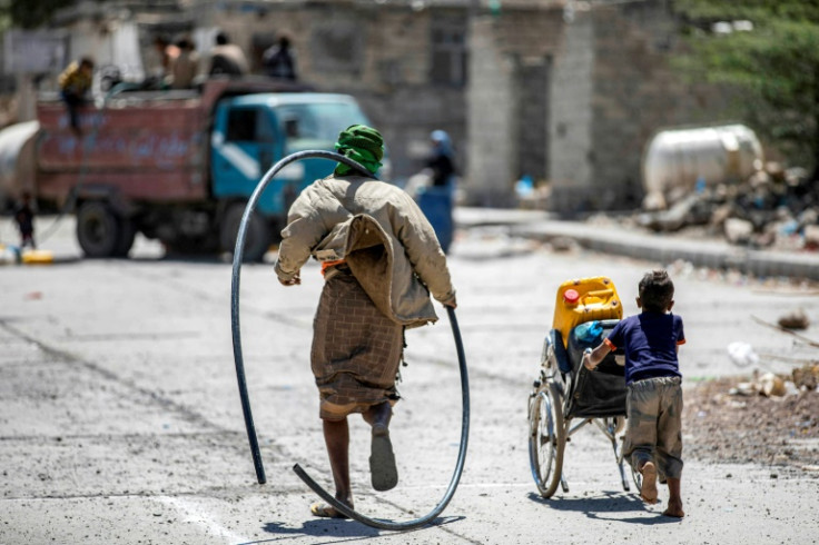 Children can wait hours hoping to fill their jerry cans