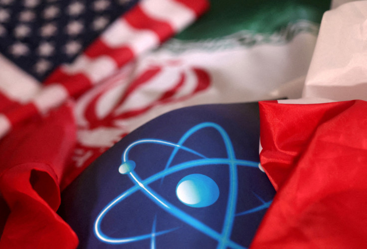 Illustration shows atomic symbol and USA and Iranian flags