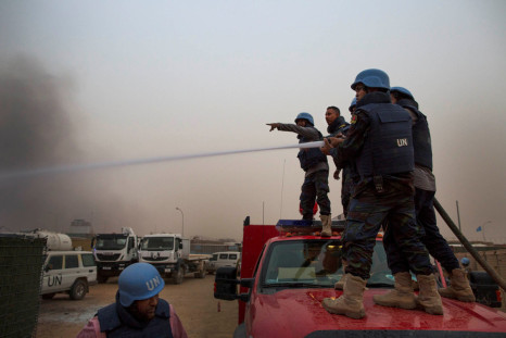 United Nations peacekeepers at the MINUSMA base fight fires after a mortar attack in Kidal, Mali