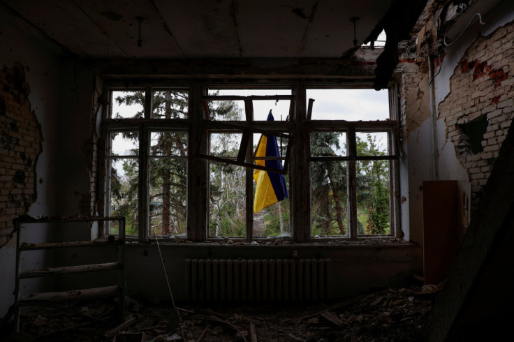 Ukrainian national flag is seen installed on a house of culture in the newly liberated village of Blahodatne