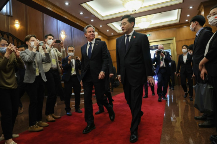 US Secretary of State Antony Blinken (L) walks with China's Foreign Minister Qin Gang (R) ahead of a meeting at the Diaoyutai State Guesthouse in Beijing on June 18, 2023.