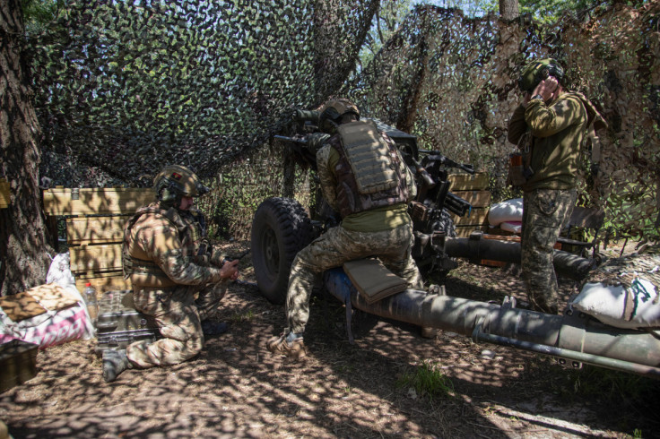 Ukrainian servicemen prepare a M119 howitzer for firing towards Russian troops at a position near a frontline in Donetsk region
