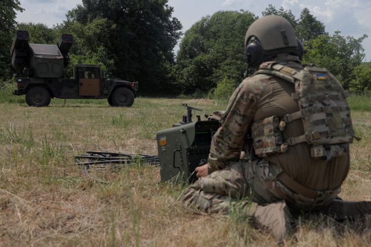 Ukrainian serviceman prepares a remote controller for an AN/TWQ-1 Avenger mobile air defence missile system outside of Kyiv