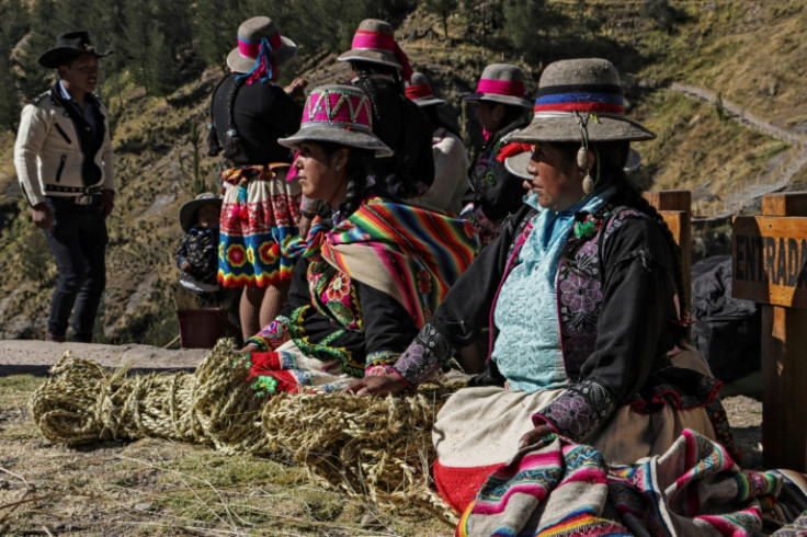 Women help make the fiber ropes, but are not allowed by custom to work on the bridge