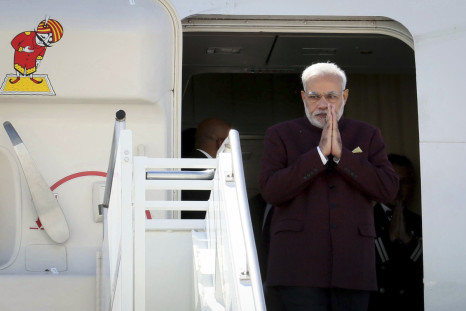 Indian Prime Minster Narendra Modi walks out of the airplane as he arrives at JFK airport in New York