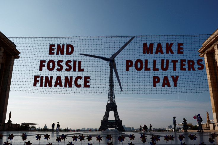 Activists turn Eiffel Tower into giant wind turbine to welcome world leaders in Paris