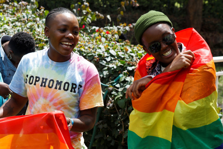 Participants react with Pride rainbow flags as they attend the Badilika festival to celebrate the LGBT rights in Nairobi
