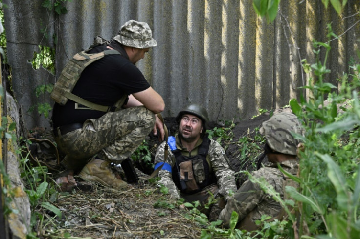 Ukrainian marines of the 35th Brigade take a break in the recently retaken village of Storozheve in the eastern Donetsk region