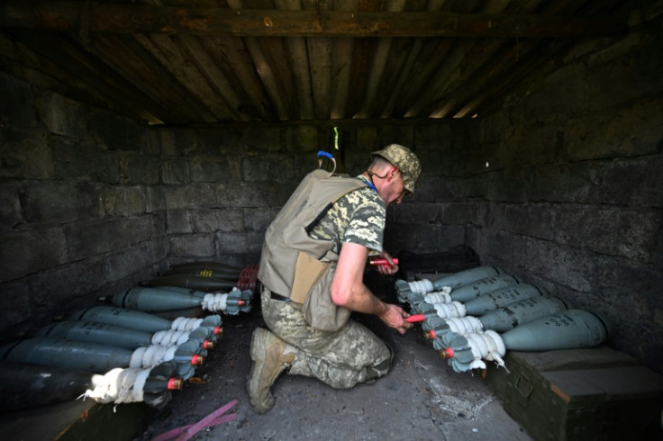 A Ukrainian marine of the 35th Brigade prepares 120mm mortar ammunition in the recently retaken village of Storozheve in the east