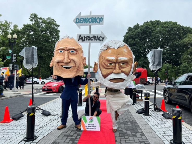 The Maryland Poor People's Campaign demonstrate with effigies of US President Joe Biden and India's Prime Minister Narendra Modi during a "Modi Not Welcome" rally in Washington