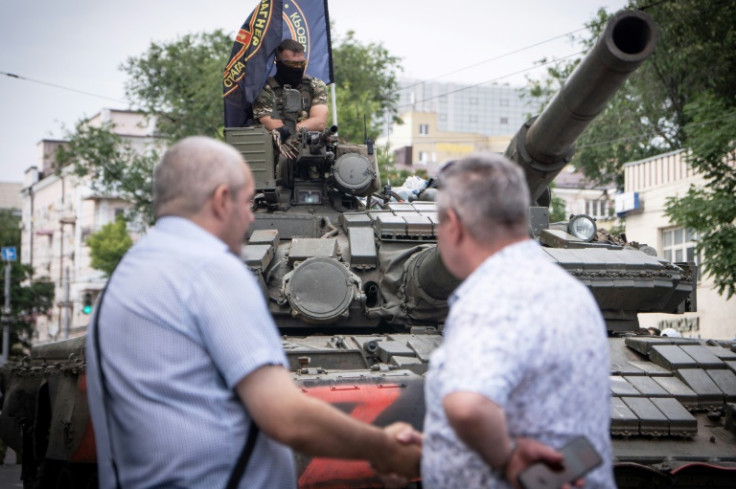 A member of Wagner group sits atop of a tank in Rostov-on-Don, a Russian city which the private military group captured on June 24, 2023