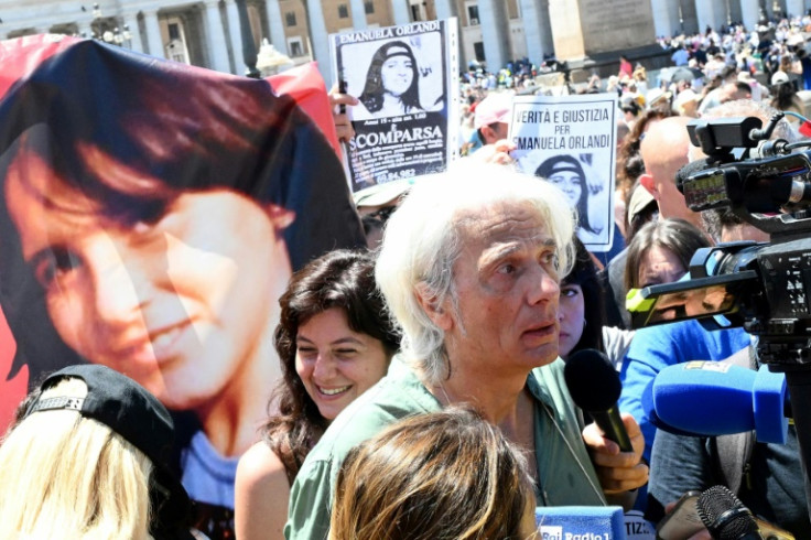 Emanuela Orlandi's brother Pietro Orlandi (C) talks with journalists at the end of Pope's Angelus prayer in St. Peter's Square