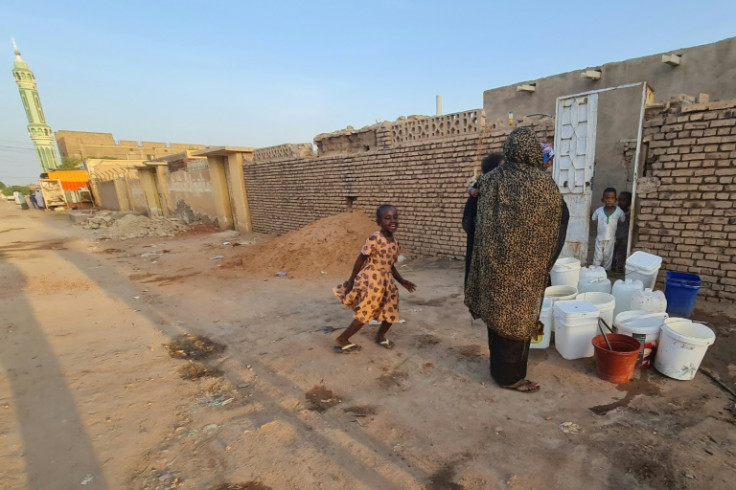 Containers of water, which is in short supply in Khartoum during Sudan's war