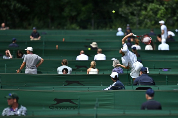 Players take part in the Wimbledon qualifying tournament in Roehampton in west London