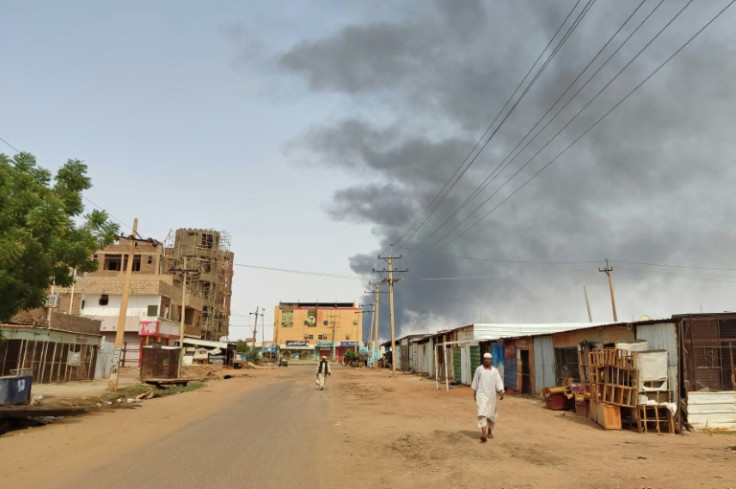 Smoke billows in Khartoum, where millions of people are still holed up