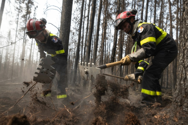 French firefighters battling flames in forests north of Quebec, as Canada faces unprecedented levels of smoke and fire