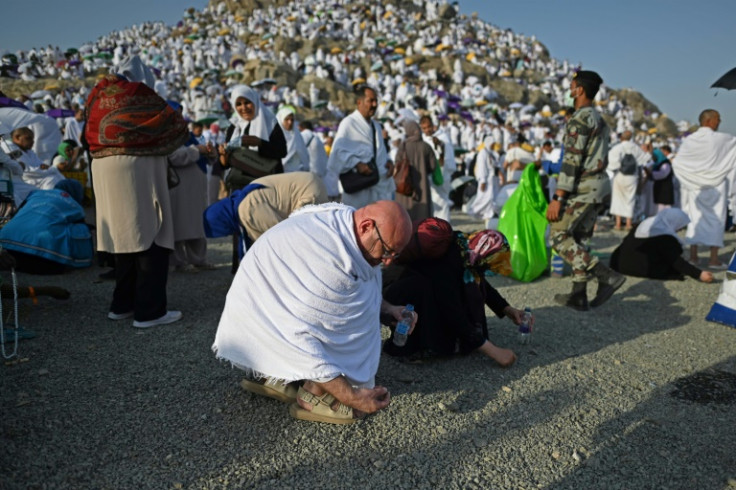 Muslim pilgrims collect pebbles at Mount Arafat during the climax of the hajj