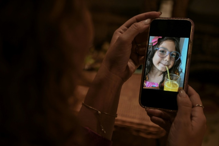 Thamirys Nunes, founder of the NGO Minha Crianca Trans (My Transgender Child), shows a picture of her daughter Agatha