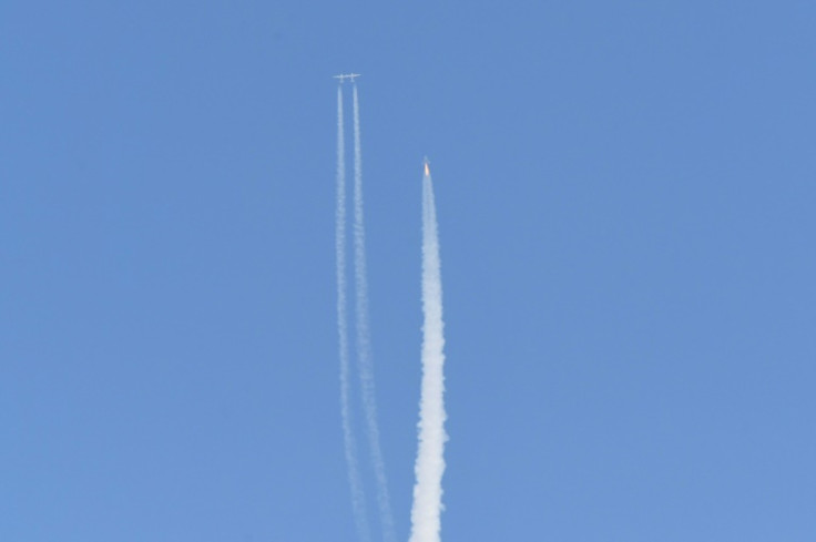 The Virgin Galactic SpaceShipTwo space plane Unity and mothership separate as they fly way above Spaceport America in New Mexico on July 11, 2021