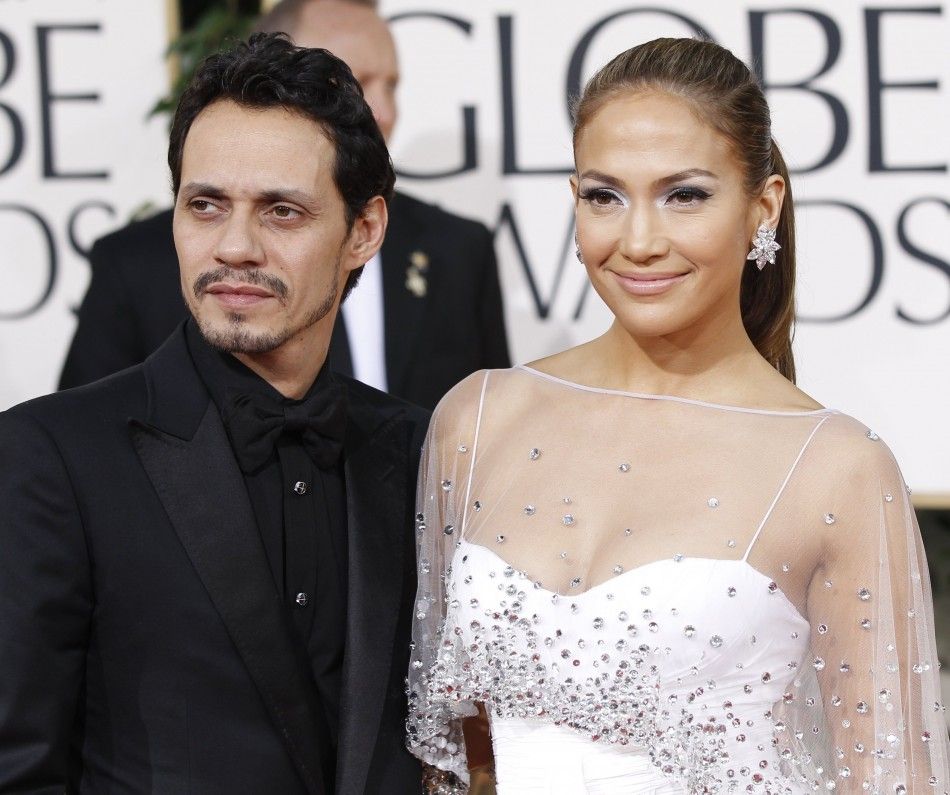 Singer Marc Anthony and his wife, actress and singer Jennifer Lopez, arrive at the 68th annual Golden Globe Awards in Beverly Hills