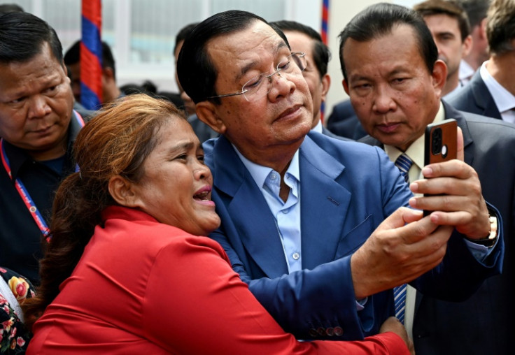 Cambodian Prime Minister Hun Sen (C) has long been a prolific Facebook user