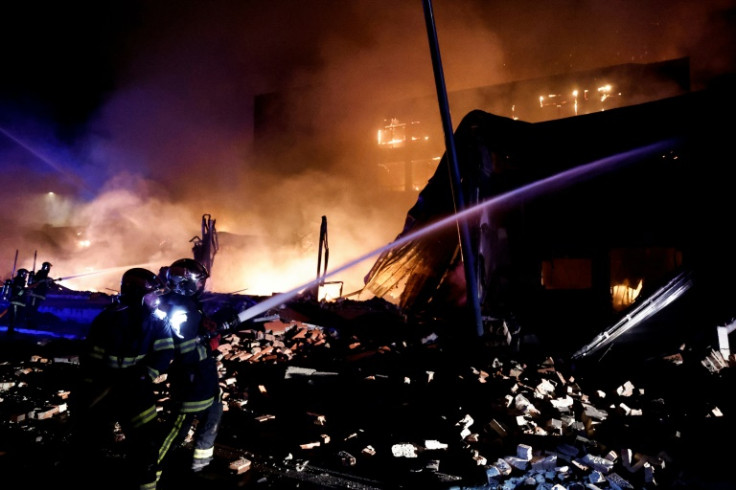 Firefighters douse the flames of a hotel that caught on fire in Roubaix