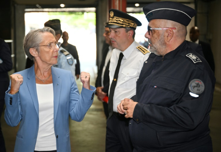 Prime Minister Elizabeth Borne, left, is attending a crisis meeting with President Emmanuel Macron