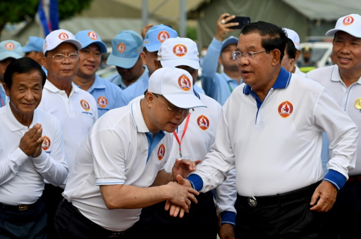 Hun Sen (R), who has ruled Cambodia for 38 years, is accused of using the legal system to crush any opposition