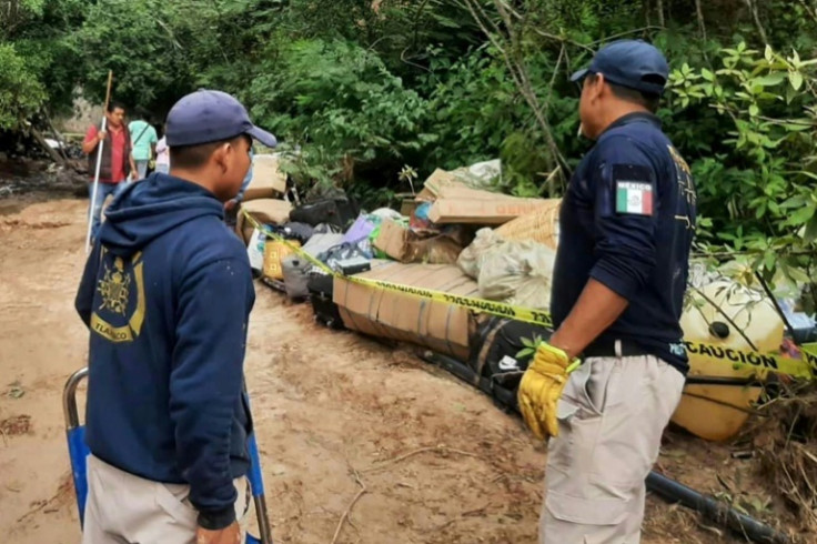 Rescuers work at the site of the bus crash in a mountainous area of southern Mexico