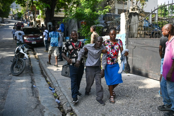Residents of Haiti's capital flee a neighborhood in Port-au-Prince due to gang-related violence