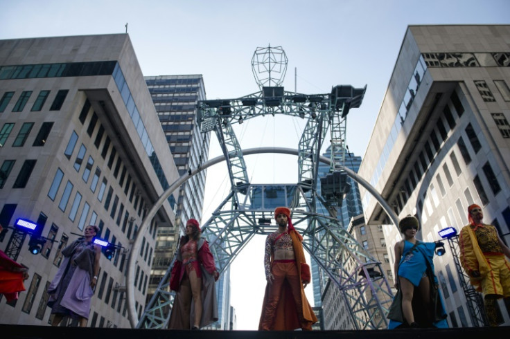 Aerial acrobats perform on a 52-foot-tall (16-meter) structure named 'The Giant' during dress rehearsal for the Montreal circus festival