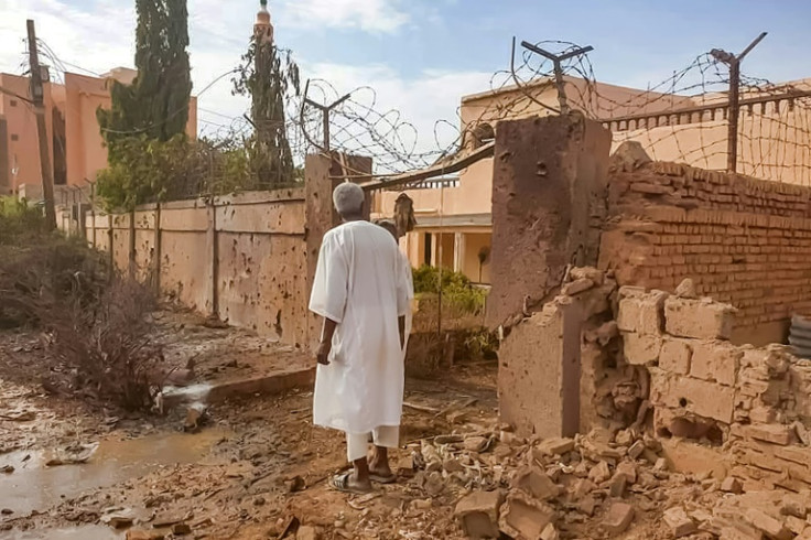 A man walks through rubble after clashes and bombardment on the western outskirts of Omdurman, the twin city of Sudan's capital, on July 4, 2023