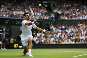 Champion style: Novak Djokovic returns the ball to Hubert Hurkacz in his fourth round match