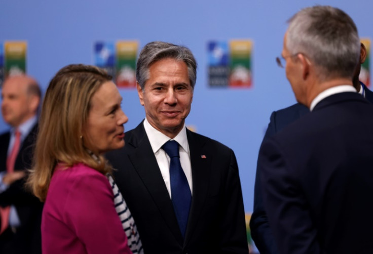 US Secretary of State Antony Blinken (C) speaks with NATO Secretary General Jens Stoltenberg at an alliance summit in Vilnius, Lithuania