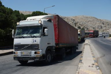 A convoy carrying humanitarian aid arrives in Syria after crossing the Bab al-Hawa border crossing with Turkey, on July 10, 2023