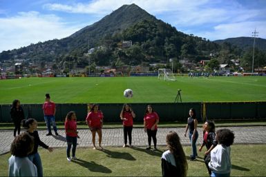 Girls play football as the Brazilian women's national team train at their Granja Comary base in Teresopolis, near Rio de Janeiro State