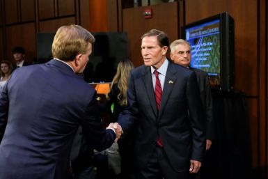 US Senator Richard Blumenthal shakes hands with Chief Operating Officer of the PGA Tour Ron Price during a Senate subcommittee hearing examining the business deal between the PGA Tour and the Public Investment Fund of Saudi Arabia, backers of LIV Golf