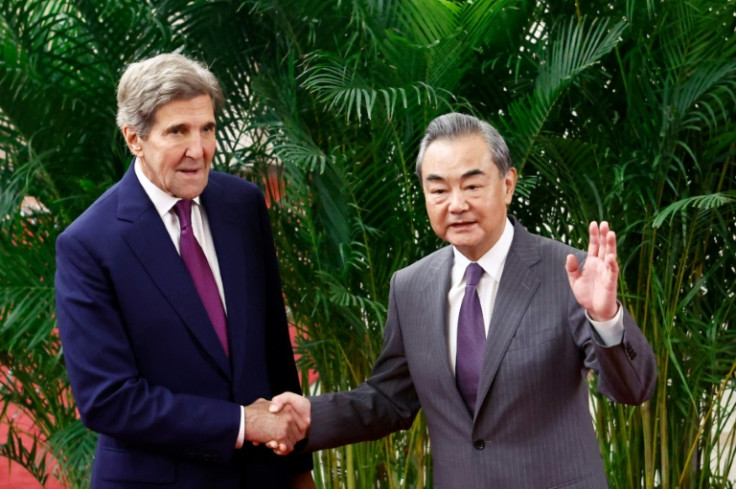 Speaking at Beijing's Great Hall of the People with China's top diplomat Wang Yi (right), Kerry (left) underlined the need for "global leadership"