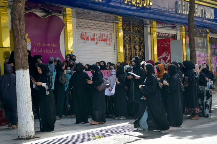 Afghan women stage a protest against the closure of beauty salons