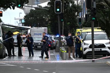 Police officers cordon off the site of a shooting in central Auckland on Thursday