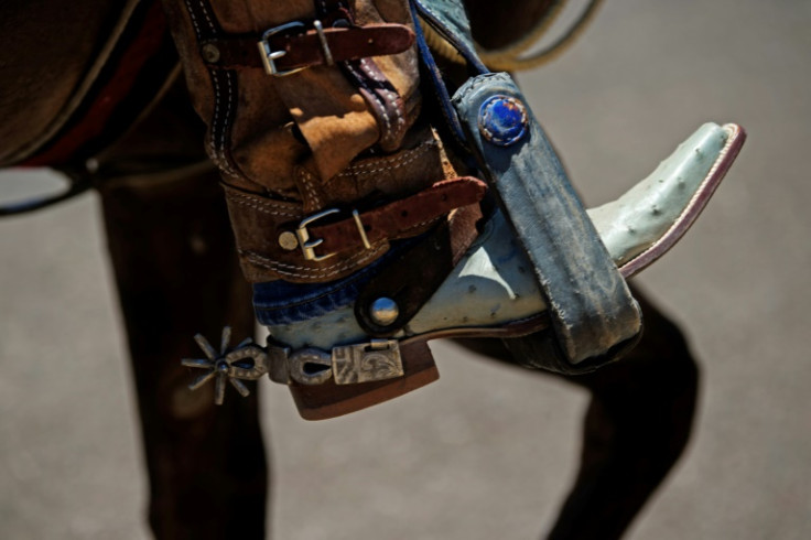 Wearing leather boots in their stirrups and cowboy hats to shield from the blazing sun, riders filled the streets of Parral