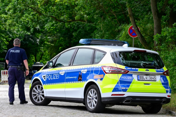 Police continued combing the streets of suburban communities southwest of Berlin in the small hours of Friday using night-vision goggles and drones