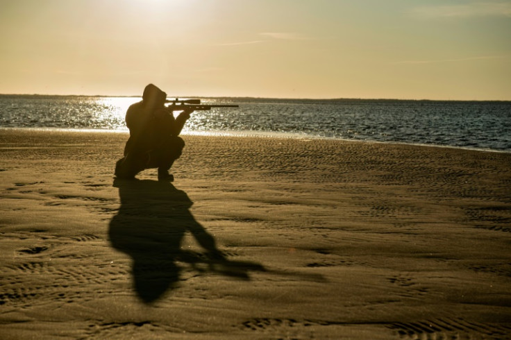 Seal hunter Yoanis Menge waits for his prey -- the controversial practice is legal in Canada, and hunters say they hope the public can see it in a new light