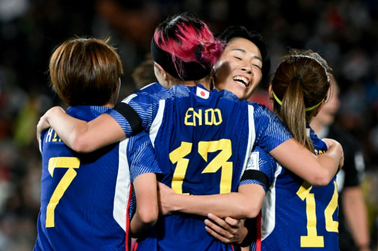 Japan's Jun Endo  celebrates scoring the team's fourth