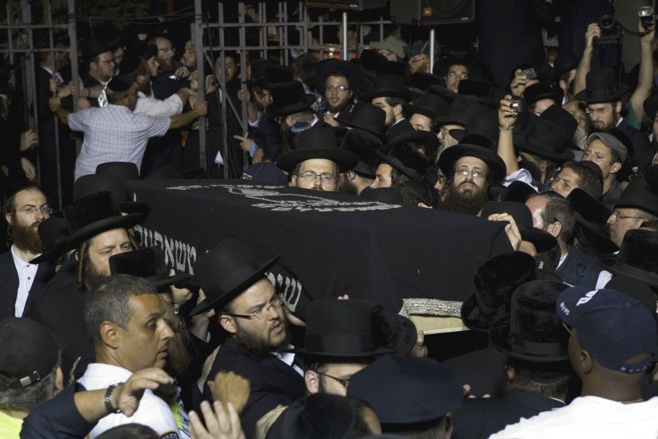  The casket of Leiby Kletzky is carried out of a synagogue after his funeral service in New York
