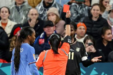 Referee Maria Carvajal shows a red card to Jamaica's forward Khadija Shaw