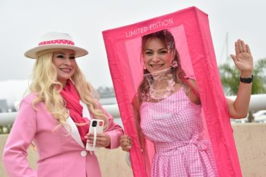 Barbie cosplayers pose outside the convention center during San Diego Comic-Con International in San Diego, California, on July 20, 2023