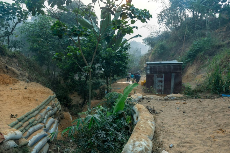 The trek for water is a daily burden for people living in metal shacks in the neighbourhood of Selembao